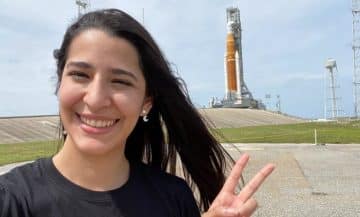 Nathalie Quintero next to Artemis 1 at NASA KSC